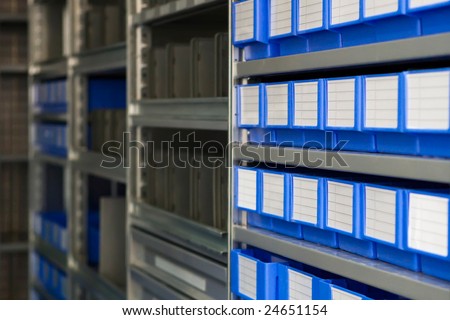 Metall racks of steel with blue boxes