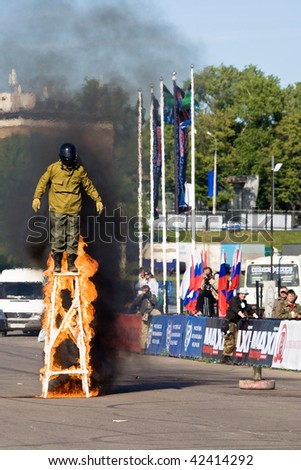 MOSCOW, RUSSIA - JUNE 6 : Stunt man Alex Sorov stands on a wooden tower in fire during a Stunt man show on June 6, 2008 in Moscow, Russia.
