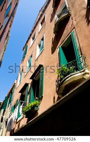 View on old house with balcony under blue sky Venice Italy