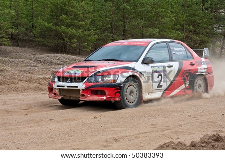 ROSTOV, RUSSIA - JULY 27: Alex Potov drives a white and red Mitsubishi Lancer car during Rostov Velikiy Russian rally championship on July 27, 2008 in Rostov, Russia.