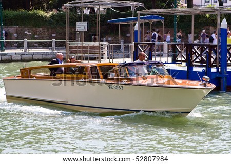 VENICE, ITALY - JULY 06: Wooden power boat driving in Crand canal diring Festival of Venica Gondalas on July 06, 2008 in Venice, Italy.