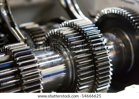 Black metallic gears in a car motor