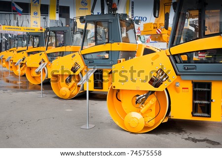 MOSCOW, RUSSIA - JUNE 02:  Orange asphalt compactor on display at the Moscow International exhibition Construction equipment and technologies on June 02, 2010 in Moscow, Russia.