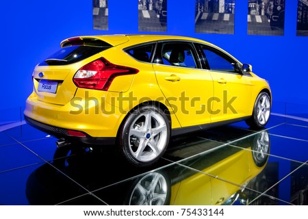 MOSCOW, RUSSIA - AUGUST 25:  Yellow car Ford Focus on display at the Moscow International exhibition InterAuto on August 25, 2010 in Moscow, Russia.