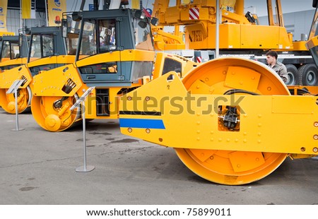 MOSCOW, RUSSIA - JUNE 02:  Orange asphalt campactor on display at Moscow International exhibition Construction equipment and technologies on June 02, 2010 in Moscow, Russia.