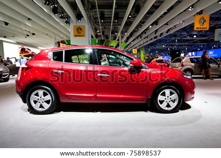 MOSCOW, RUSSIA - AUGUST 25:  Red car Renault Megane  on display at Moscow International exhibition InterAuto on August 25, 2010 in Moscow, Russia.