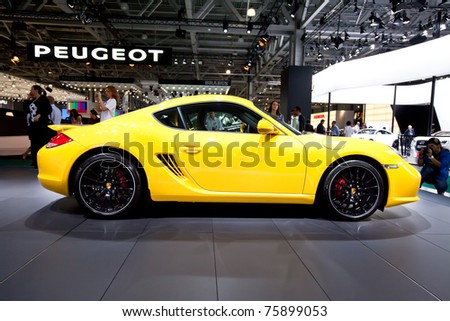 MOSCOW, RUSSIA - AUGUST 25: Yellow sport car Porsche  Cayman S   on display at Moscow International exhibition InterAuto on August 25, 2010 in Moscow, Russia.