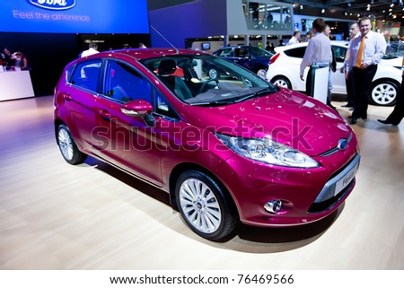 MOSCOW, RUSSIA - AUGUST 25:  Red car Ford Fiesta on display at Moscow International exhibition InterAuto on August 25, 2010 in Moscow, Russia.
