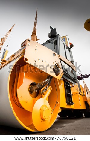 MOSCOW, RUSSIA - JUNE 02:  Orange asphalt campactor on display at Moscow International exhibition Construction equipment and technologies on June 2, 2010 in Moscow, Russia.