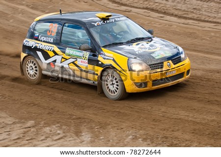 ROSTOV, RUSSIA - SEPTEMBER 05: Ditaliy Sochov drives a black and yellow Renault Clio car during Rostov Velikiy Russian rally championship on September 05, 2010 in Rostov, Russia.
