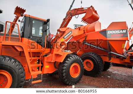 MOSCOW, RUSSIA - JUNE 02:  Orange diesel front end loader on display at Moscow International exhibition Construction equipment and technologies on JUNE 02, 2010 in Moscow, Russia.
