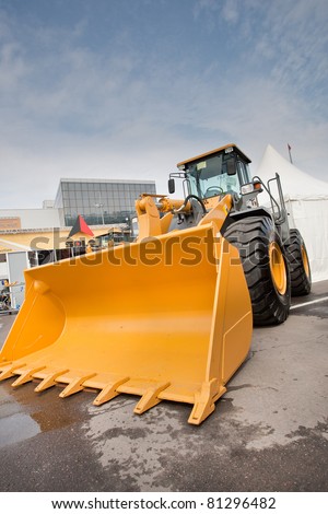 MOSCOW, RUSSIA - JUNE 02:  Orange diesel front end loader on display at Moscow International exhibition Construction equipment and technologies on JUNE 02, 2010 in Moscow, Russia.
