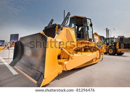 MOSCOW, RUSSIA - JUNE 02:  Orange diesel bulldozer on display at Moscow International exhibition Construction equipment and technologies on JUNE 02, 2010 in Moscow, Russia.