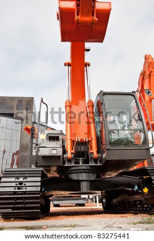 MOSCOW, RUSSIA - JUNE 02:  Orange diesel excavator on display at Moscow International exhibition Construction equipment and technologies on JUNE 02, 2010 in Moscow, Russia.
