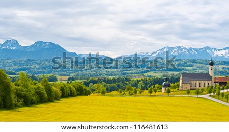 Church on the Hill on the Background of Snowcapped Alps, Germany