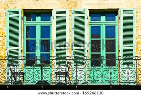 French Balcony with Open Wooden Shutters