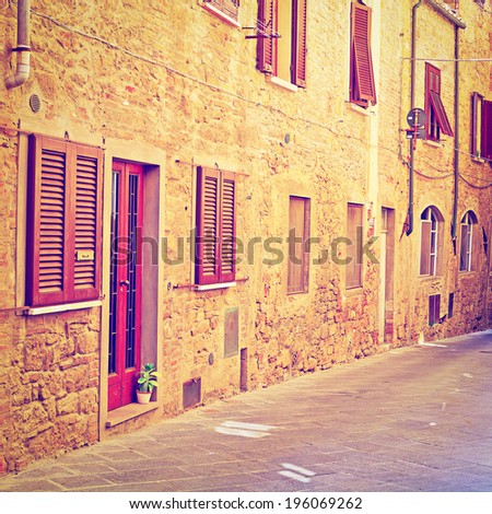 Narrow Alley with Old Buildings in Italian City of Volterra, Retro Effect