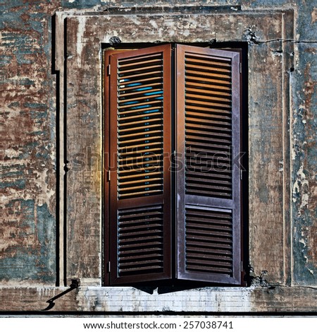 Italian Window with Closed Wooden Shutters in the Rome, Vintage Style Toned Picture