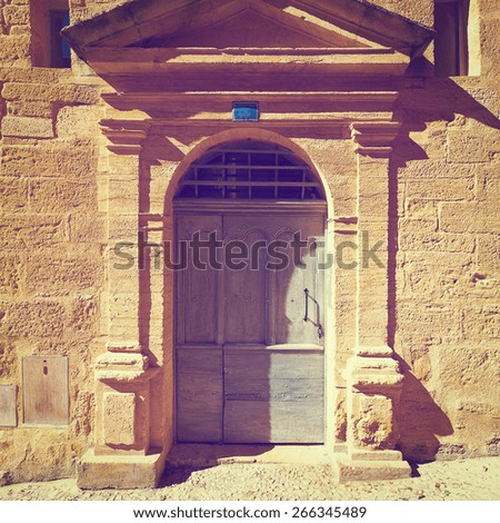 Solid Wooden Door Decorated with Pediment in the French City, Vintage Style Toned Picture