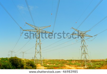 Row Of High Voltage Electricity Pole In Sandbar