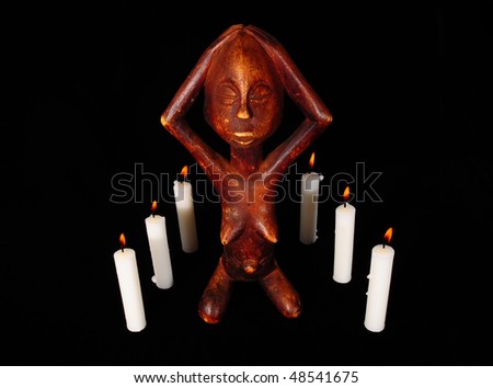 African Wooden Figure, Praying Before the  Candle in the Dark