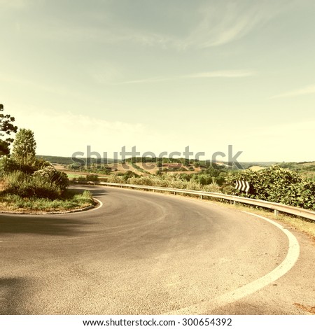 Winding Paved Road in the Tuscany, Italy, Vintage Style Toned Picture