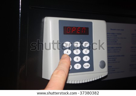 a hand entering a code into the keypad