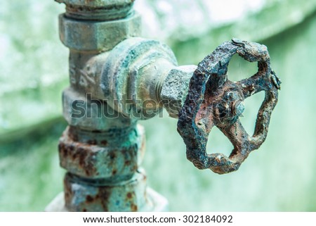 rusty and old water faucet