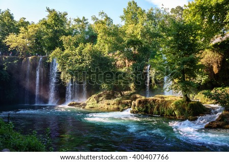 Duden waterfall Antalya, Turkey. Untouched wild nature. Waterfall stream. Panoramic view on Duden Waterfall park. Forest lake. Waterfall surrounded by forest. Vivid summer nature. Travel landmarks.