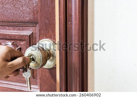 man hand Locking the Door