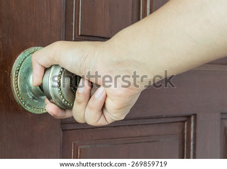 Man hand open door knob - hand focus
