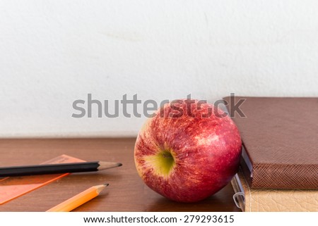 Red apple and book - Concept of education
