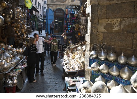 Cairo, Egypt - January 2010: Tourists between the craft stall of the Khal El Khalili market