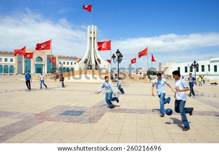Tunis, Tunisia - May 4 2007:  Local boys playing football in the Town Hall square