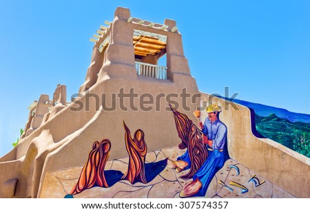 Taos, U.S.A. - May 22 2011:  New Mexico, typical architecture and murals  in the country center