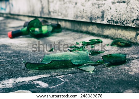 Broken wine bottle on the pavement