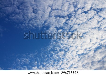 White clouds on a blue sky, weird pattern