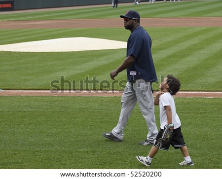 BALTIMORE - MAY 1: David Ortiz and son D\'Angelo walk on the field before a game at Camden Yards on May 1, 2010 in Baltimore, Maryland