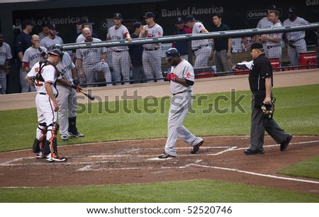 BALTIMORE - MAY 1: David Ortiz of the Boston Red Sox celebrates at home plate after hitting one of two home runes during a game at Camden Yards on May 1, 2010 in Baltimore, Maryland