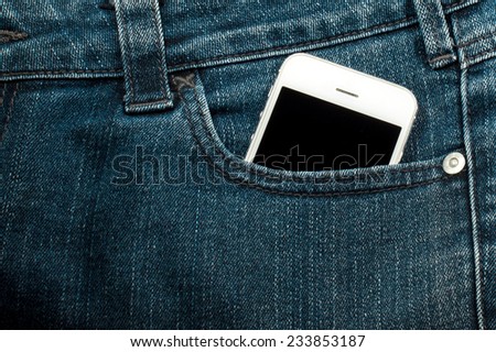 white mobile phone in pocket with black screen.