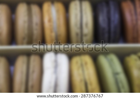 raditional french sweet dessert colorful delicious macarons in a rows blurred background