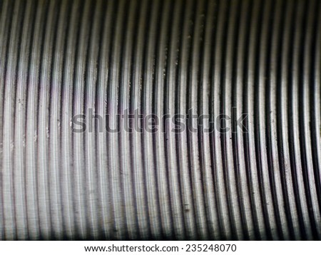 Steel surface the reverse side of the pan - ?ircular grooves - Stainless steel - Closeup