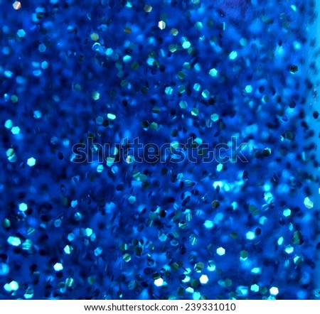 blue background with sparkling silver sequins