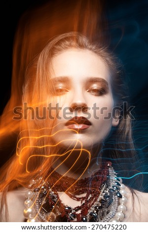 Fashion model portrait with accessories with mixed light