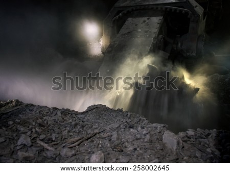Coal mining harvester while working at a depth of about 700 meters underground