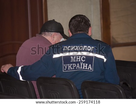 Donetsk, Ukraine - April, 11, 2014: Psychologists Ministry of Emergency Situations are working with the relatives of the dead miners in an accident at the mine named Skochinskiy