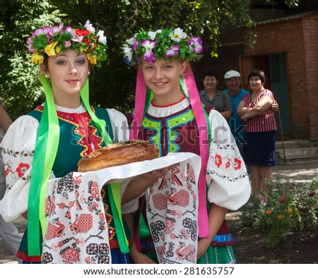 Donetsk, Ukraine - 26 July, 2013: Girls in national costumes prepare to welcome miners Donetsk Coal Energy Company with extracted 1000 000 tonnes of coal this year