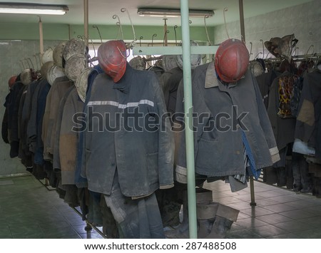 Overalls miners working in the locker room