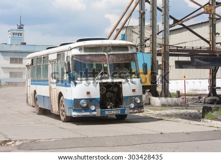 Ugledar; Ukraine - July 17; 2013: Old bus designed to transport miners coming to collect the next shift