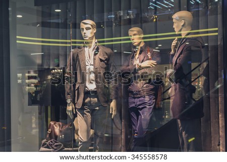 Male mannequin in a shop window. Fashion and sales